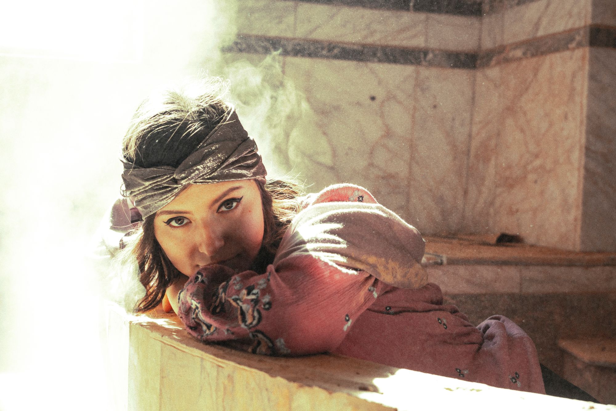 Woman resting on the warm marble of a hammam