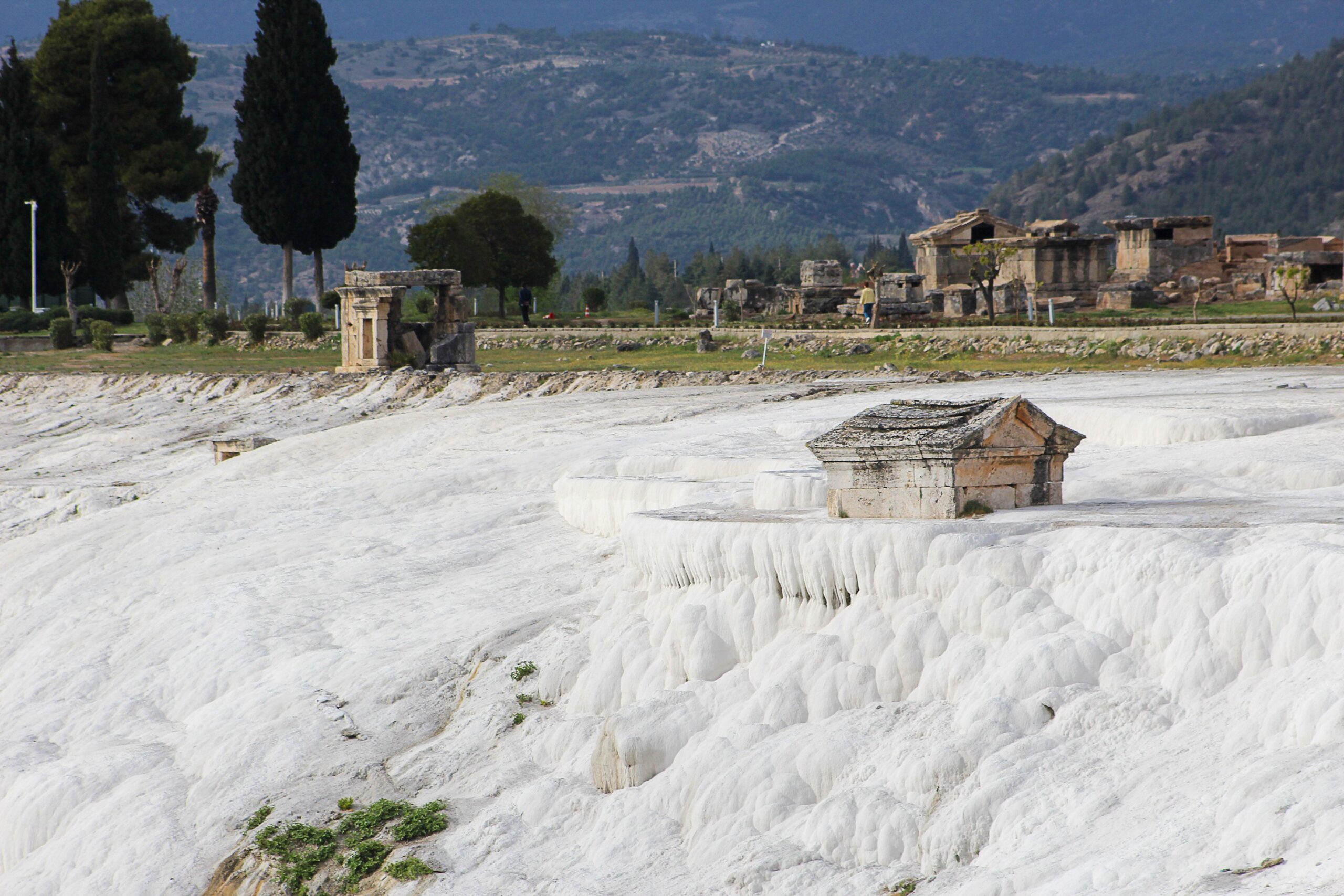 Pamukkale terraces with Hierapolis ruins above