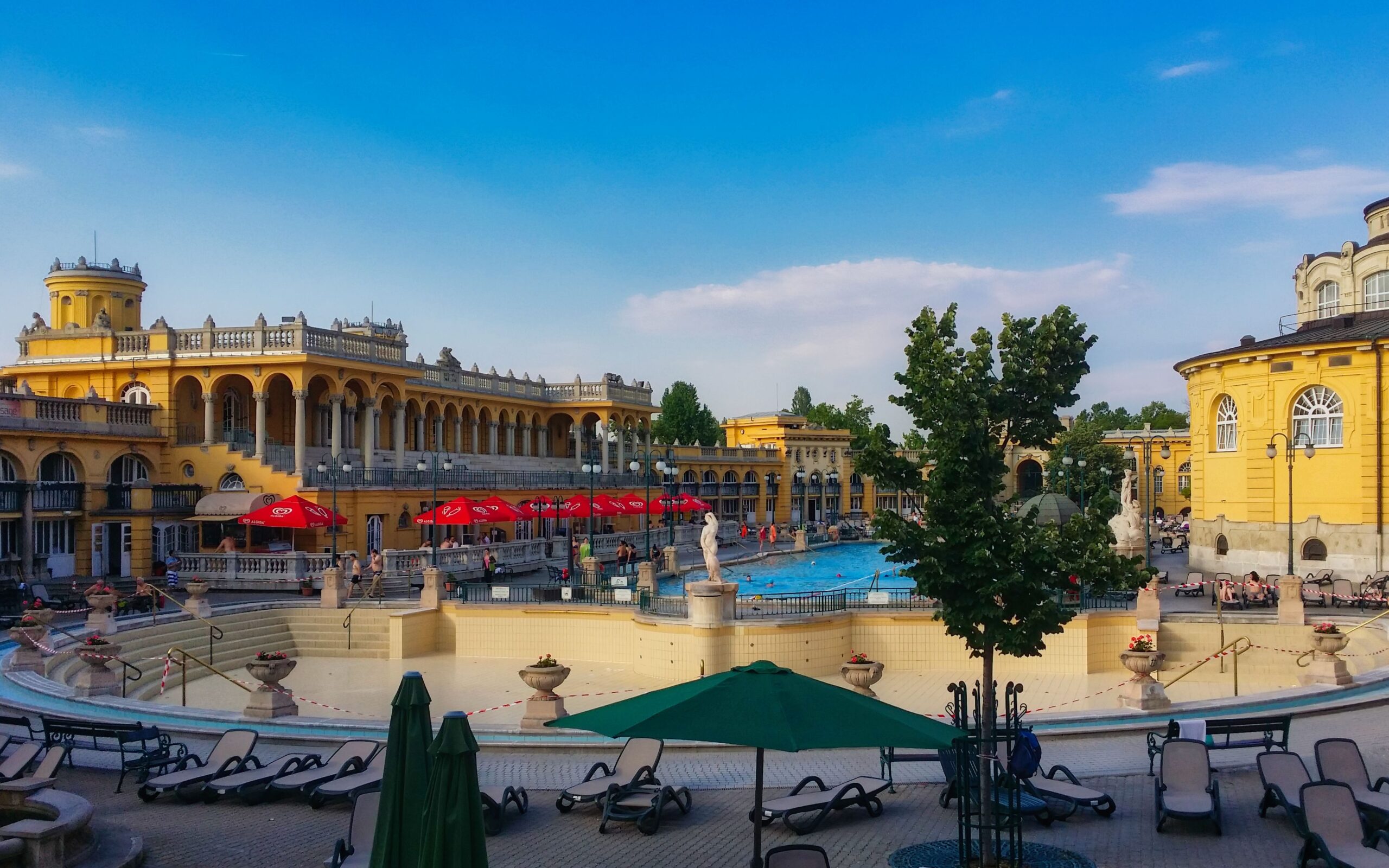 Outdoor thermal pools of Széchenyi Thermal Bath in Budapest, framed by its neo-baroque buildings